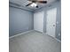 Bedroom with tiled floor, ceiling fan, closet space, and freshly painted walls at 9516 Newdale Way # 101, Riverview, FL 33578