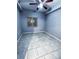 A bedroom with neutral tile, window, ceiling fan, and minimalist decor at 9516 Newdale Way # 101, Riverview, FL 33578