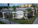 Attractive entrance sign for the Villages of Bloomingdale, surrounded by palms and a black metal fence at 9516 Newdale Way # 101, Riverview, FL 33578