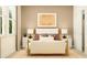 Inviting bedroom with modern decor, bedside lamps and a large sunny window at 9657 Runaway Breeze Dr, Land O Lakes, FL 34637