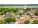 Aerial view of apartment complex with swimming pool, parking, landscaping, and water views at 10100 Sailwinds N Blvd # 105, Largo, FL 33773