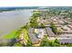 Apartments next to a lake with some landscaping at 10100 Sailwinds N Blvd # 105, Largo, FL 33773