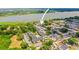 Aerial view of apartment complex with swimming pool, parking, landscaping, and water views at 10100 Sailwinds N Blvd # 105, Largo, FL 33773