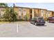 Exterior view of a multi-Gathering residence with ample parking and well-maintained landscaping at 10100 Sailwinds N Blvd # 105, Largo, FL 33773