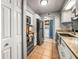 Updated kitchen featuring stainless steel appliances, tile floors, and white cabinets at 10100 Sailwinds N Blvd # 105, Largo, FL 33773