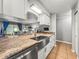Updated kitchen with granite countertops, stainless steel appliances, and an open layout at 10100 Sailwinds N Blvd # 105, Largo, FL 33773