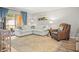 Comfortable living room with ample seating, stylish decor, and natural light at 10100 Sailwinds N Blvd # 105, Largo, FL 33773