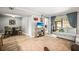 Open-concept living room with hardwood floors, neutral tones, and a dining area at 10100 Sailwinds N Blvd # 105, Largo, FL 33773