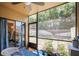 Screened patio offering a serene outdoor space with a view of the backyard and ample sunlight at 10100 Sailwinds N Blvd # 105, Largo, FL 33773