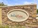 Elegant stone community sign reading 'Bella Vista on Lake Seminole' at 10100 Sailwinds N Blvd # 105, Largo, FL 33773
