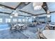 Spacious ballroom featuring elegant lighting, neutral colors, and large windows at 10420 Echo Dock Loop, San Antonio, FL 33576