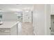 Inviting foyer with tile flooring and an open view to the living area at 10420 Echo Dock Loop, San Antonio, FL 33576
