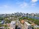 An aerial shot displays a neighborhood near the water, set against the backdrop of a modern city skyline at 105 E Davis Blvd # A, Tampa, FL 33606