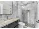Renovated bathroom features a marble vanity, sleek fixtures, and a glass-enclosed shower at 105 E Davis Blvd # A, Tampa, FL 33606