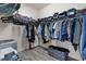 Walk-in closet with organized shelving and clothing racks for optimal storage at 11308 Temperley Pl, Tampa, FL 33625