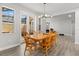 Bright dining room featuring hardwood floors and sliding glass doors to the lanai at 11308 Temperley Pl, Tampa, FL 33625
