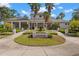 Clubhouse with mature landscaping and exterior lighting at 11308 Temperley Pl, Tampa, FL 33625