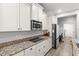 Beautiful kitchen featuring granite countertops, stainless steel appliances, and white cabinets at 11308 Temperley Pl, Tampa, FL 33625