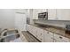 Charming kitchen with granite countertops, stainless steel appliances, and undermount sink at 11308 Temperley Pl, Tampa, FL 33625