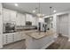 Modern kitchen with granite countertops, stainless steel appliances, and white cabinetry at 11308 Temperley Pl, Tampa, FL 33625