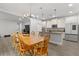 Open-concept kitchen and dining area with modern finishes and appliances at 11308 Temperley Pl, Tampa, FL 33625