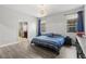 Spacious main bedroom with hardwood floors, natural light, and en-suite bathroom at 11308 Temperley Pl, Tampa, FL 33625
