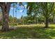 Enjoy the serenity of the nearby pond with seating area and mature trees at 11308 Temperley Pl, Tampa, FL 33625