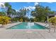 Community pool offers a refreshing retreat, surrounded by beautiful landscaping at 11308 Temperley Pl, Tampa, FL 33625
