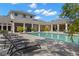 Community pool area with sun loungers at 11308 Temperley Pl, Tampa, FL 33625