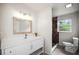 Contemporary bathroom featuring a stylish vanity, a framed mirror, and a modern walk-in shower, creating a luxurious retreat at 115 S Saturn Ave, Clearwater, FL 33755