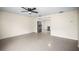 Open-concept living room with tile flooring, neutral color palette, and kitchen access for easy entertaining at 115 S Saturn Ave, Clearwater, FL 33755