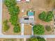 Stunning aerial view of home showing large lot, mature trees, and long driveway at 11514 Sun Rd, Dade City, FL 33525