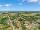 Expansive aerial view of community, showcasing beautiful countryside and blue skies at 11514 Sun Rd, Dade City, FL 33525