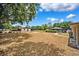 Large backyard with a screened pool, outbuilding, and lots of room for entertaining or recreation at 11514 Sun Rd, Dade City, FL 33525
