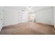 Empty bedroom featuring neutral carpet, curtains, and a ceiling fan at 11514 Sun Rd, Dade City, FL 33525