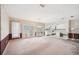 Dining area with chandelier and glass doors leading to the outside space and kitchen at 11514 Sun Rd, Dade City, FL 33525