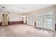 Dining area with chandelier and glass doors leading to the outside space at 11514 Sun Rd, Dade City, FL 33525