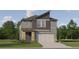 Charming two-story home featuring a modern design, a two-car garage, and a beautifully landscaped front yard at 11546 E 71St Ter, Palmetto, FL 34221