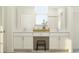 Bright bathroom with double vanity, white cabinetry, and natural light from a window at 11554 71St E Ave, Palmetto, FL 34221