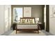Comfortable bedroom with a wood bed frame, featuring white bedding, natural light, and golf-themed artwork at 11554 71St E Ave, Palmetto, FL 34221