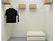 Well-organized closet with shelving, an ottoman, and clothing rack for storage at 11554 71St E Ave, Palmetto, FL 34221