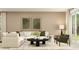 Inviting living room with a comfortable white sectional sofa, modern decor, and ample natural light at 11554 71St E Ave, Palmetto, FL 34221