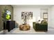 Relaxing living room with fashionable accents, a sleek TV, and comfortable seating at 11554 71St E Ave, Palmetto, FL 34221