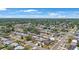This aerial view showcases a residential neighborhood with lush greenery and well-maintained homes at 11619 80Th Ave, Seminole, FL 33772