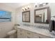 Bathroom features double sinks, framed mirrors and bright light fixtures at 11619 80Th Ave, Seminole, FL 33772