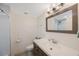 Bathroom with a tiled walk-in shower, a vanity, a large mirror and a toilet at 11619 80Th Ave, Seminole, FL 33772