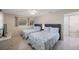 Bright bedroom featuring twin beds, a ceiling fan, and access to an ensuite bathroom at 11619 80Th Ave, Seminole, FL 33772