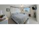 A bright main bedroom boasts a bed with decorative pillows and a ceiling fan at 11619 80Th Ave, Seminole, FL 33772