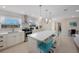 Island kitchen with a breakfast bar, stainless appliances, and bright lighting at 11619 80Th Ave, Seminole, FL 33772