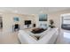 Cozy living room featuring a comfortable sofa, entertainment center, and stylish decor at 11619 80Th Ave, Seminole, FL 33772